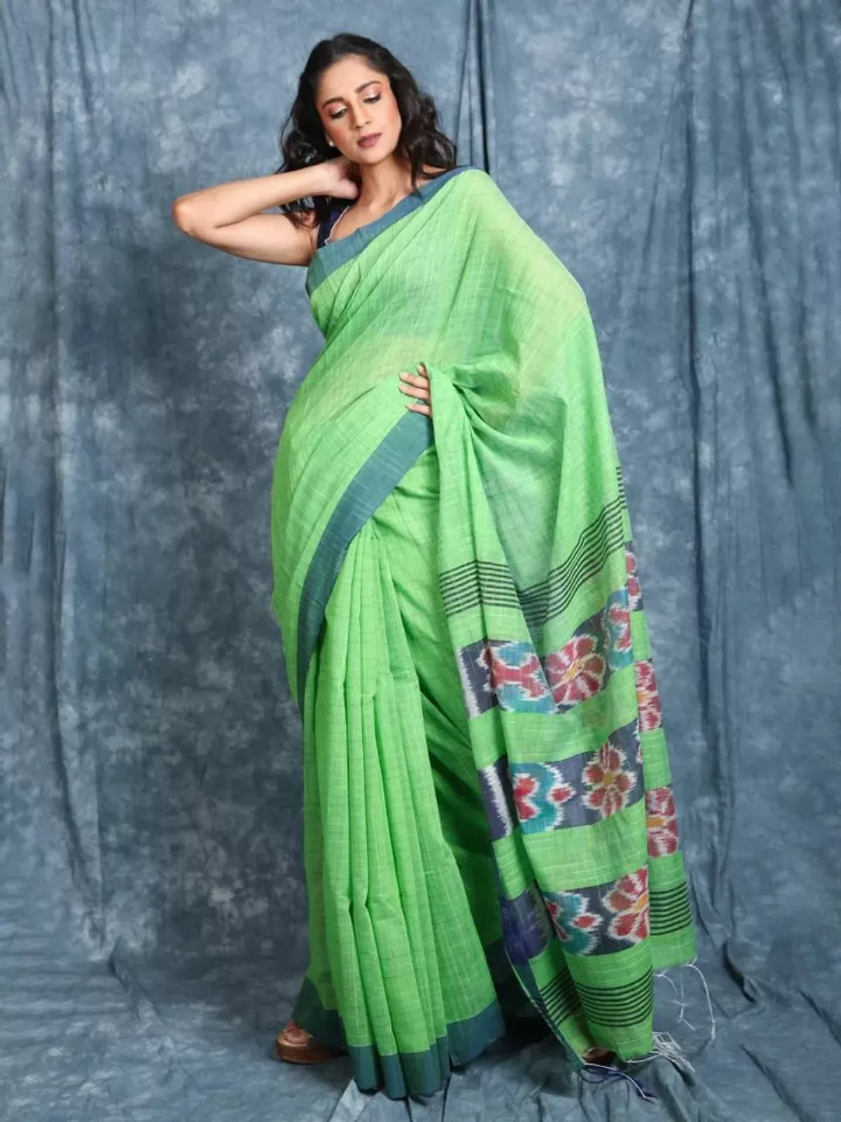 Green shibori-style printed mul mul cotton saree with floral buttas,  self-border & pallu of diamond patterns